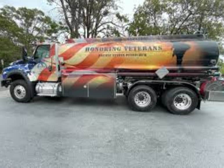 a large truck with big tank on the back